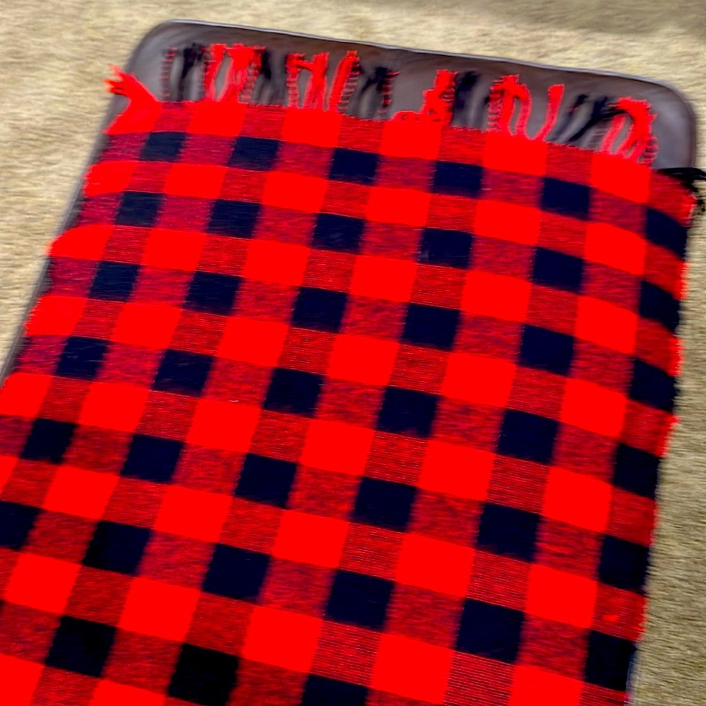 Shawl red/black. Not worn great for outside fire or indoor fire